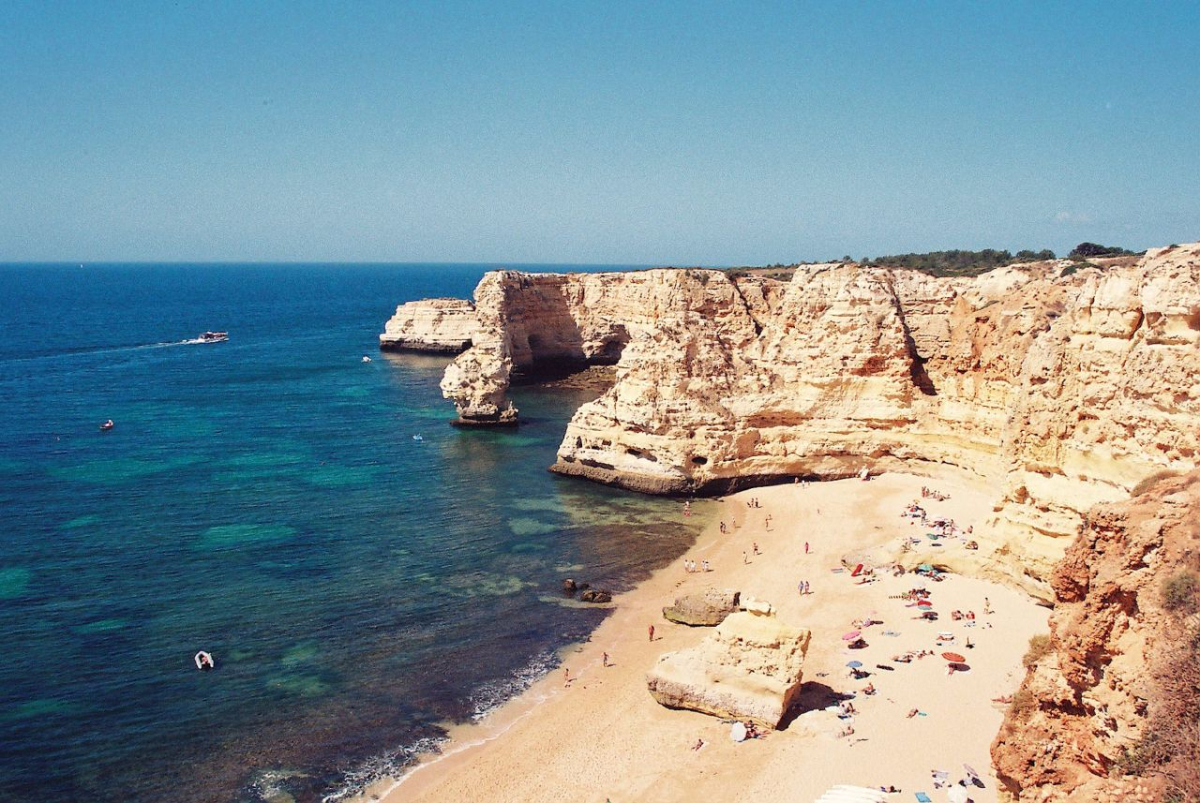Coastal rock arches and sea at Praia da Marinha