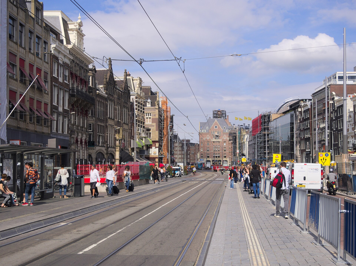 Tram tracks and a tram in the Rokin streetscape. Tram tracks and a tram in the Rokin streetscape.