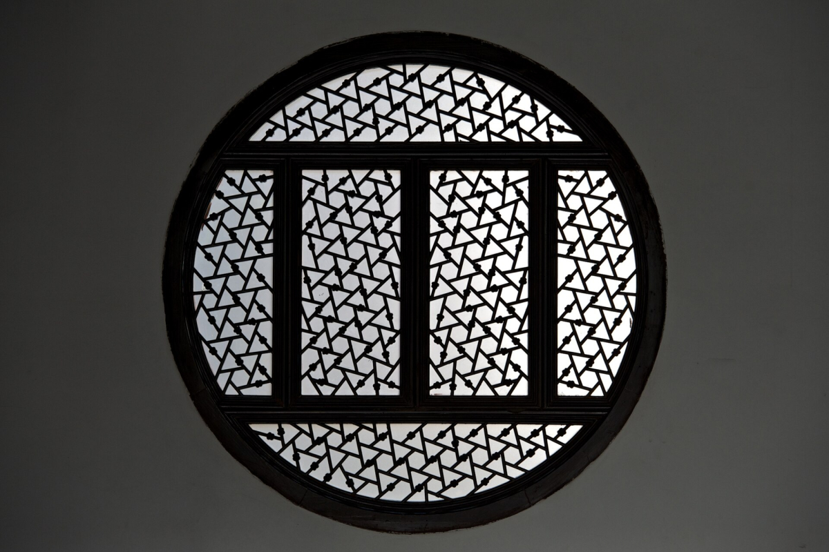 A decorative circular window in a Suzhou classical garden A decorative circular window in a Suzhou classical garden