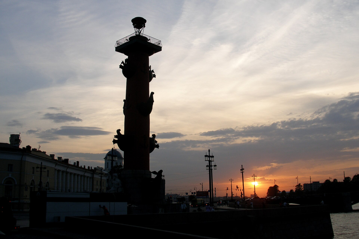 Rostral Column and Saint Petersburg beneath the setting sun