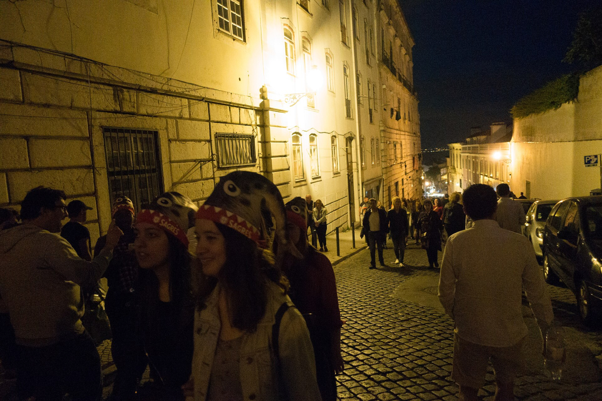 Visitors walking during a Santo António evening in Lisbon