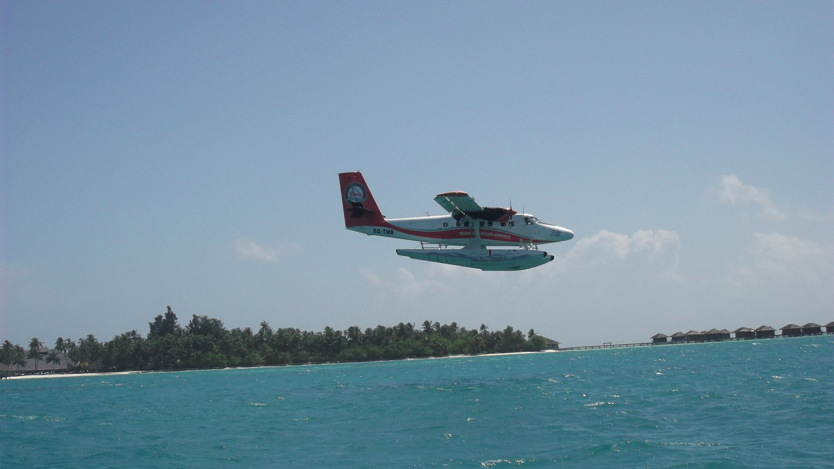 A seaplane landing in the Maldives