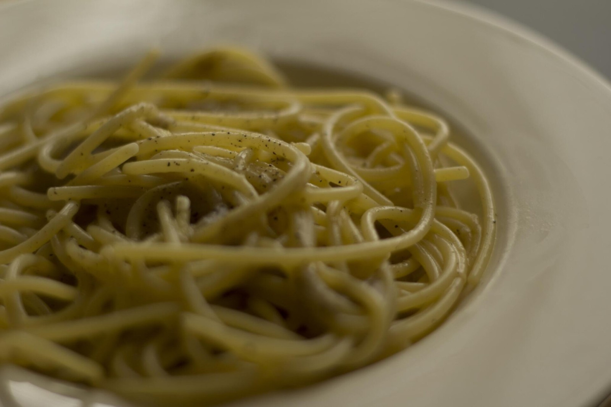 Spaghetti cacio e pepe with grated cheese and black pepper Spaghetti cacio e pepe with grated cheese and black pepper