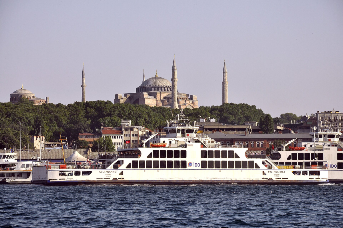 The Sultanahmet ferry on the water with Hagia Sophia behind it