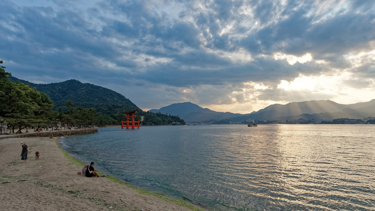The coastline and distant torii at Miyajima The coastline and distant torii at Miyajima