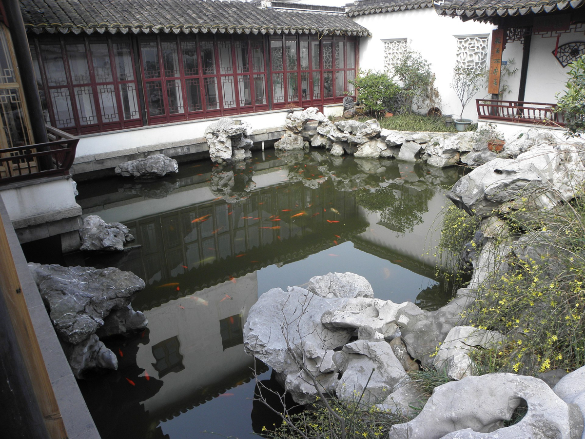 Covered walkway and pond in a Suzhou classical garden Covered walkway and pond in a Suzhou classical garden