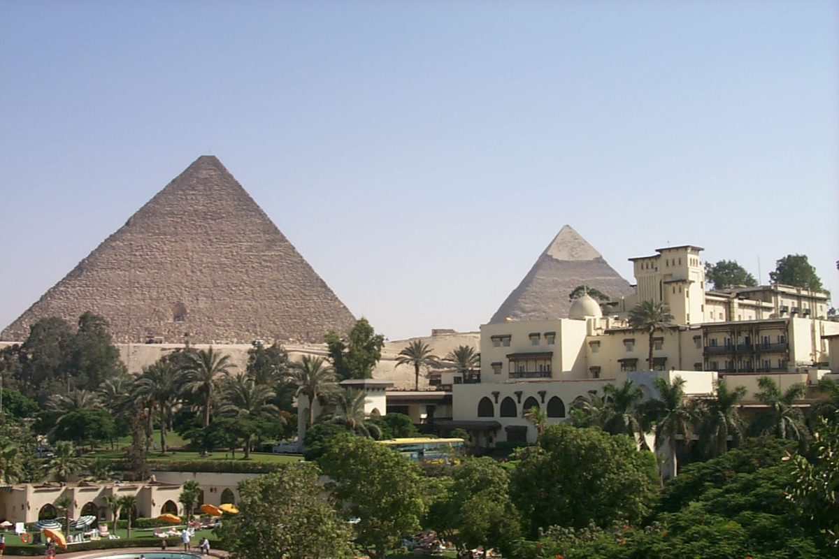 Mena House buildings and gardens with Giza pyramids beyond Mena House buildings and gardens with Giza pyramids beyond