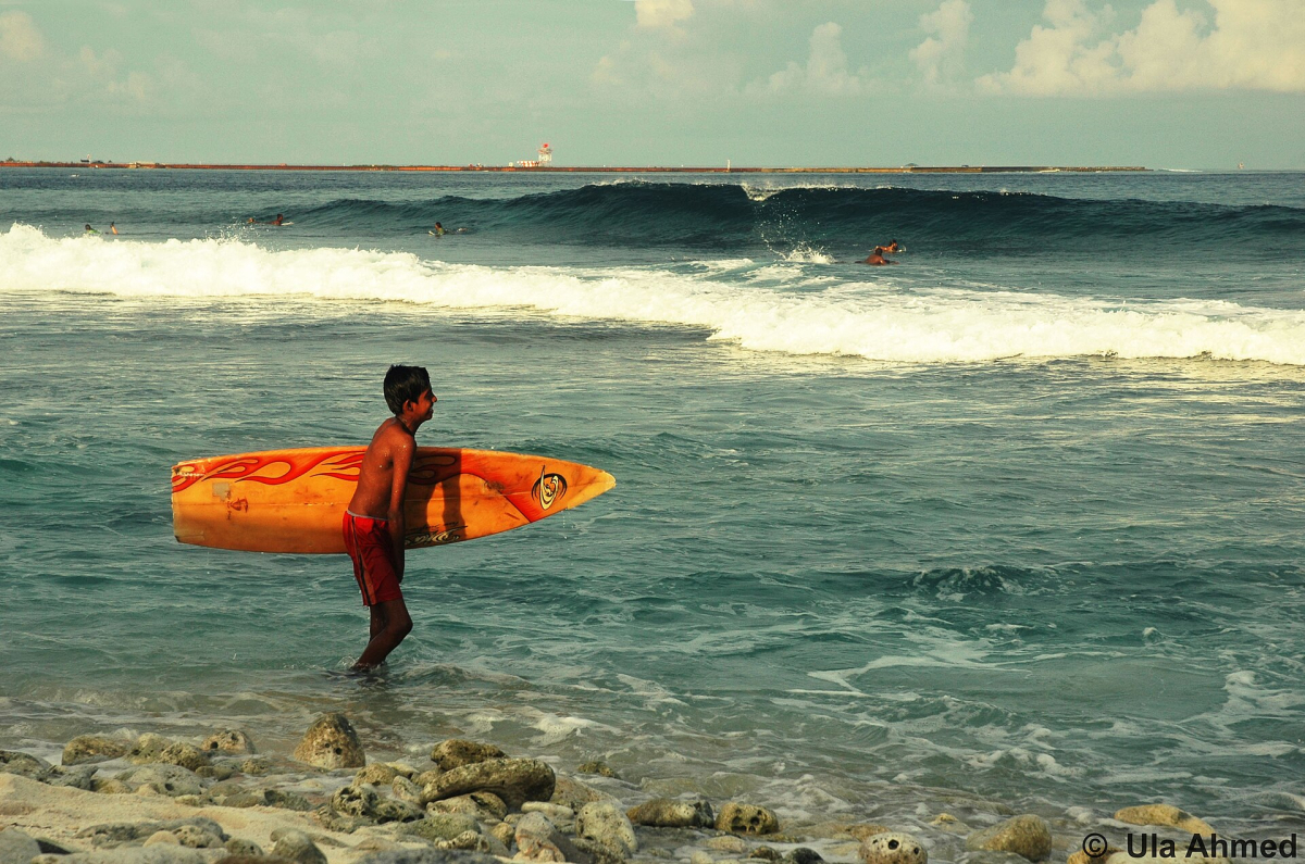 A young surfer in the Maldives A young surfer in the Maldives