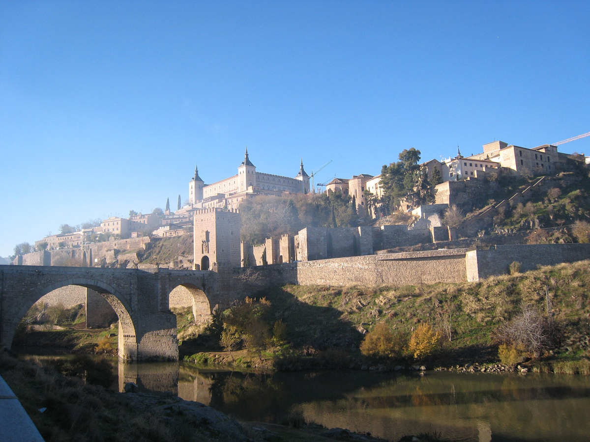 Toledo above the Tagus, with a bridge and the historic city beyond.
