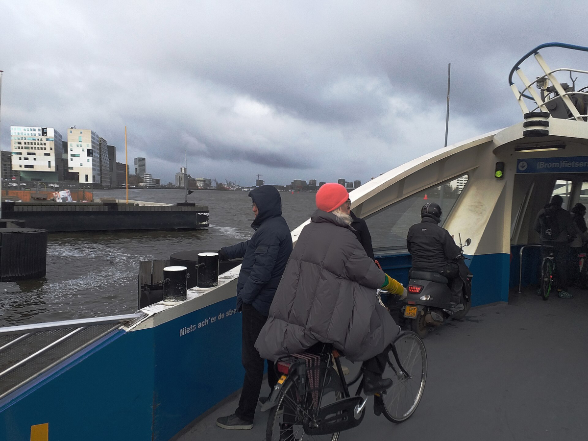 Cyclists aboard an IJ ferry. Cyclists aboard an IJ ferry.