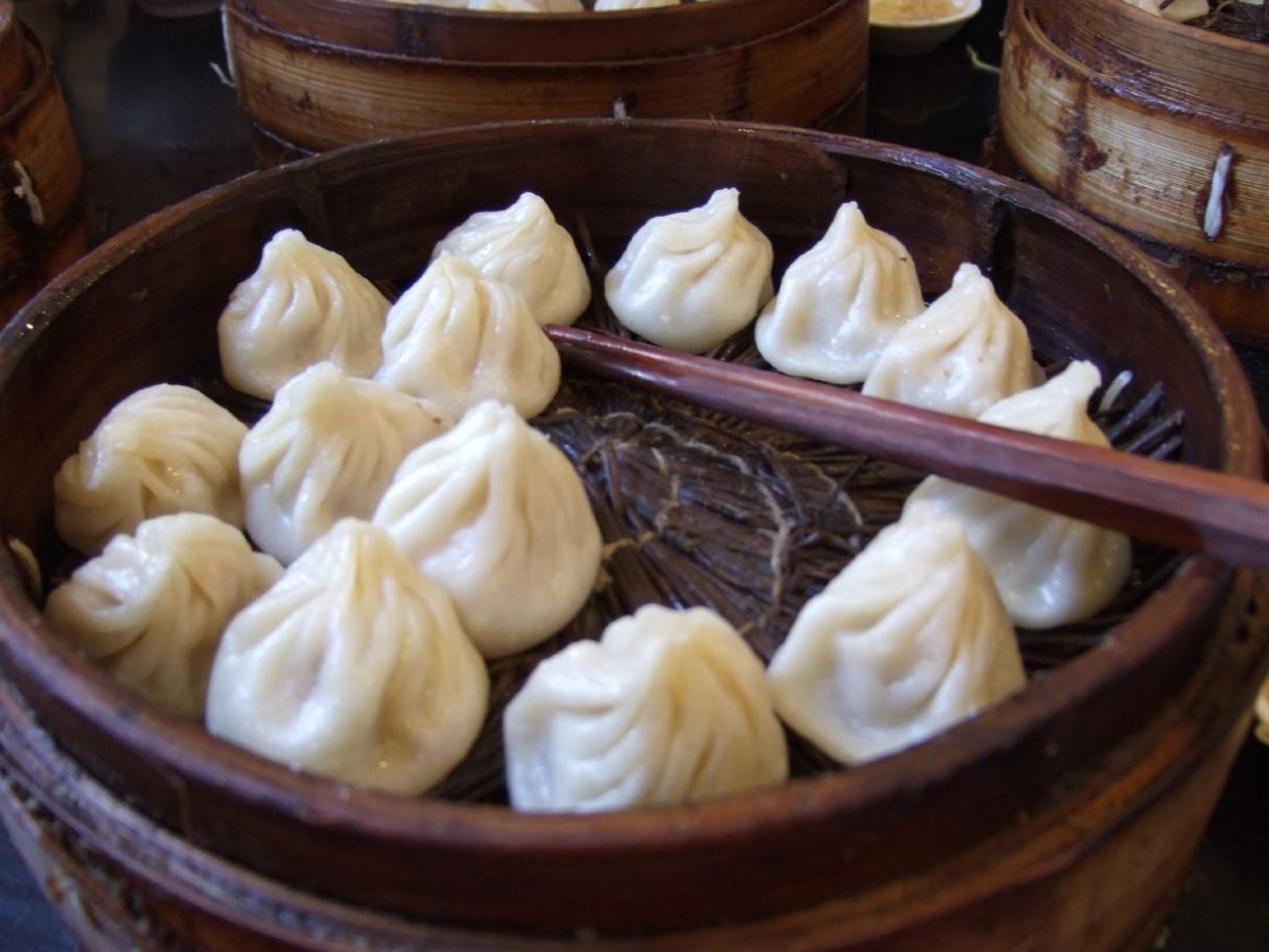 Soup dumplings served in a steamer Soup dumplings served in a steamer