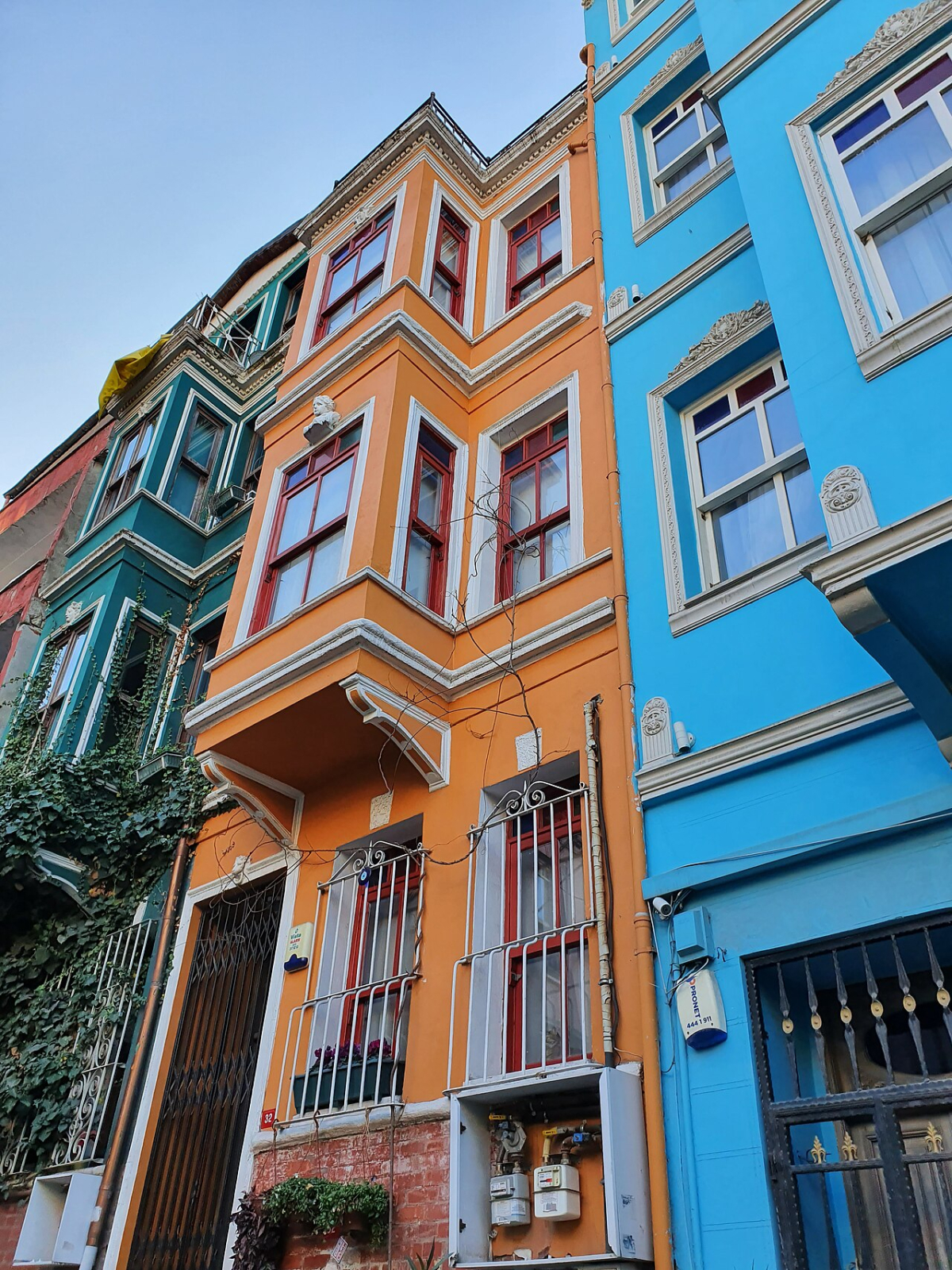 Colourful blue, orange and green house facades in Balat, Istanbul