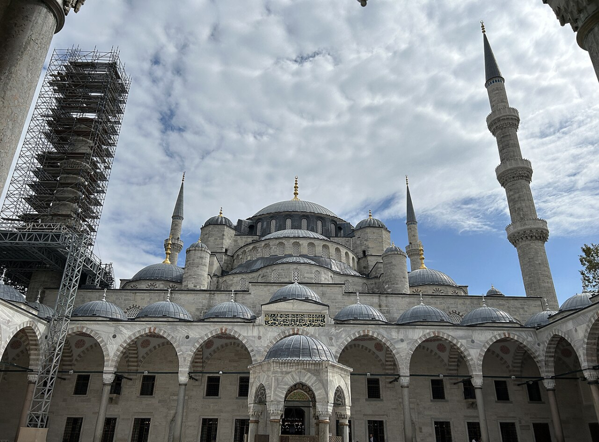 The Blue Mosque courtyard with domes, minarets and a central fountain