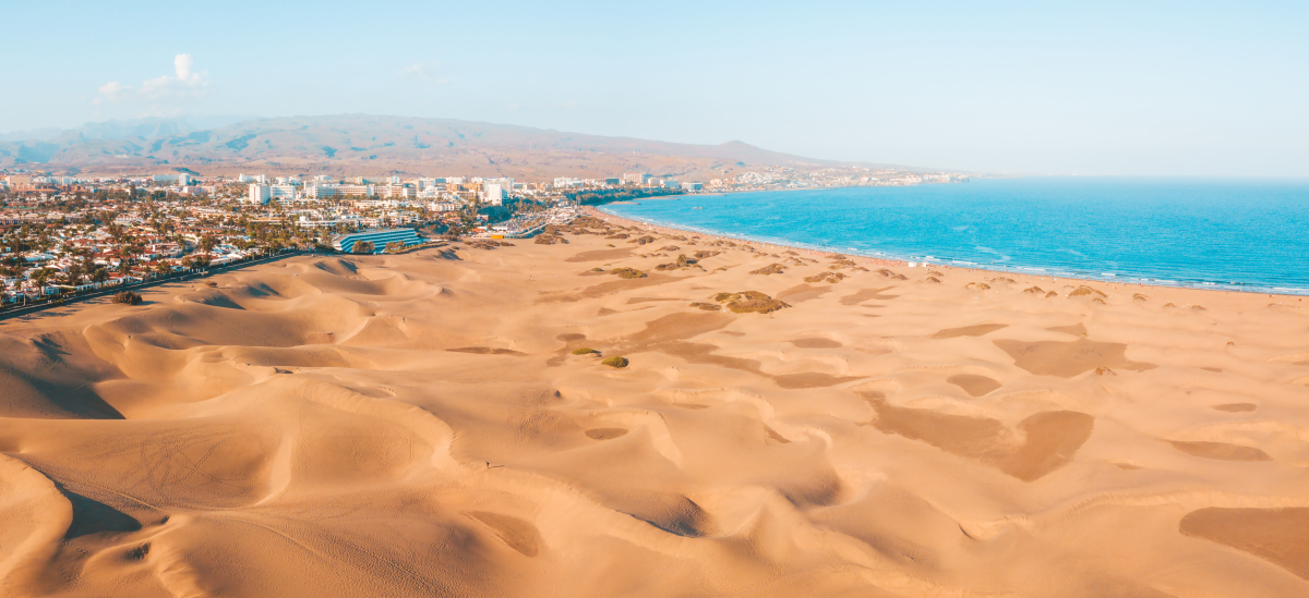 Maspalomas Dunes meeting the Atlantic Ocean in Gran Canaria