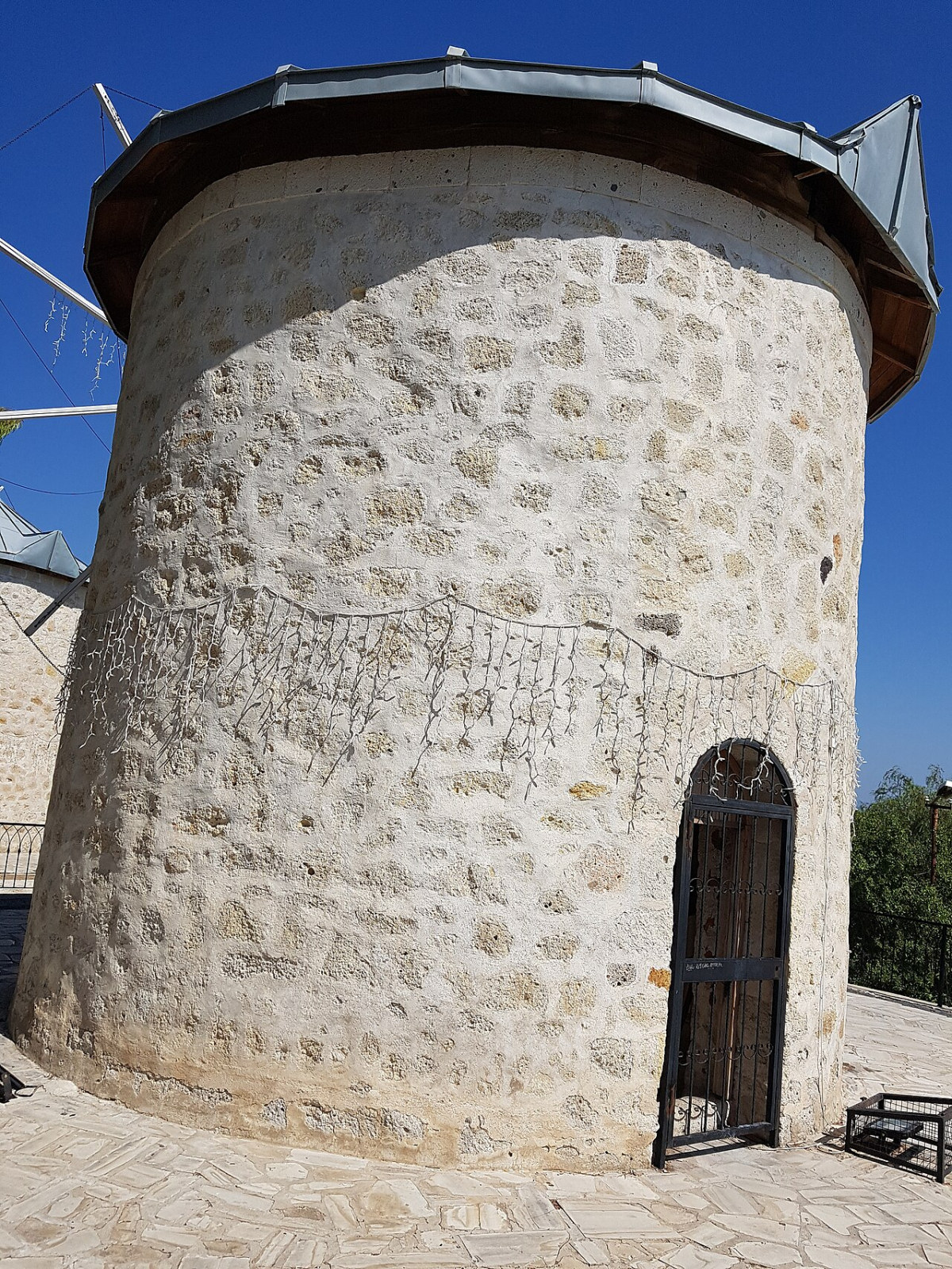 Historic stone windmill tower in Alaçatı