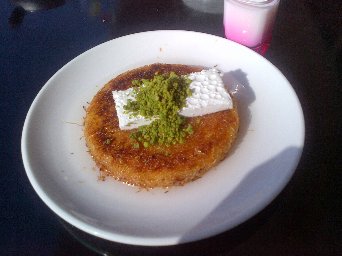 Künefe dessert topped with kaymak and pistachio