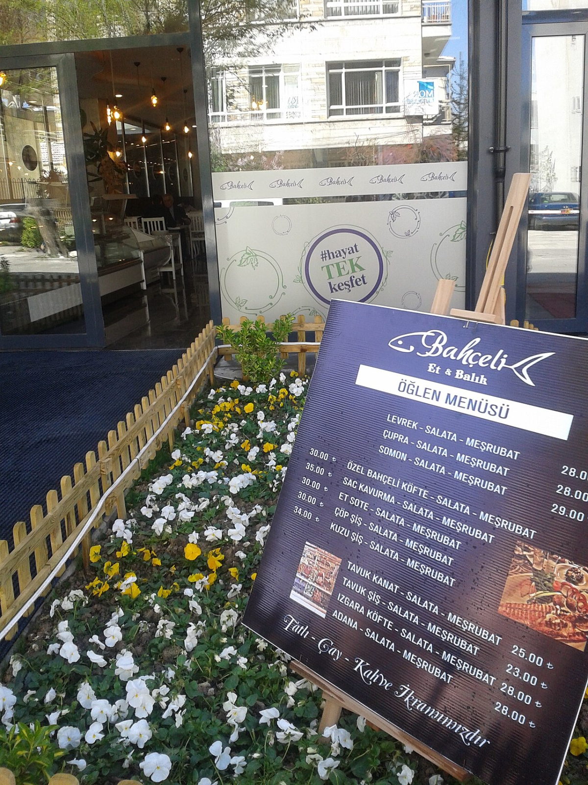 A menu board outside a Turkish restaurant