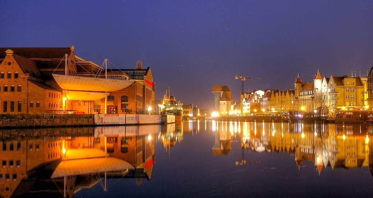 Polish Baltic Philharmonic beside the water at night Polish Baltic Philharmonic beside the water at night