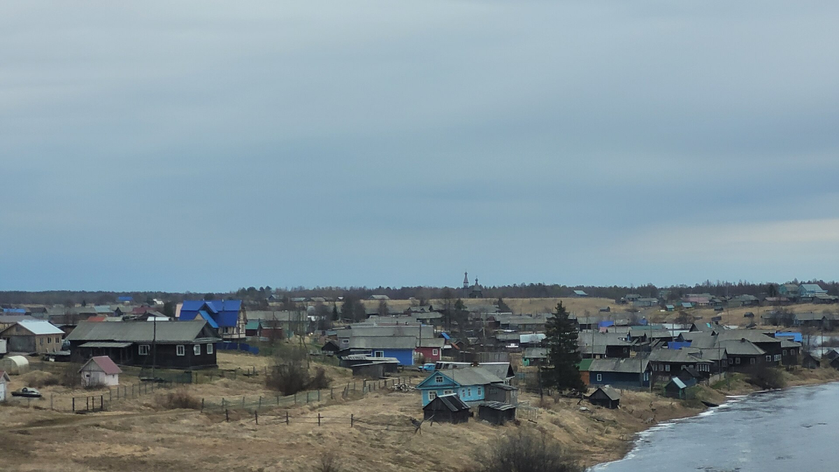 Wooden houses and coastal village setting at Nukhcha, Karelia Wooden houses and coastal village setting at Nukhcha, Karelia