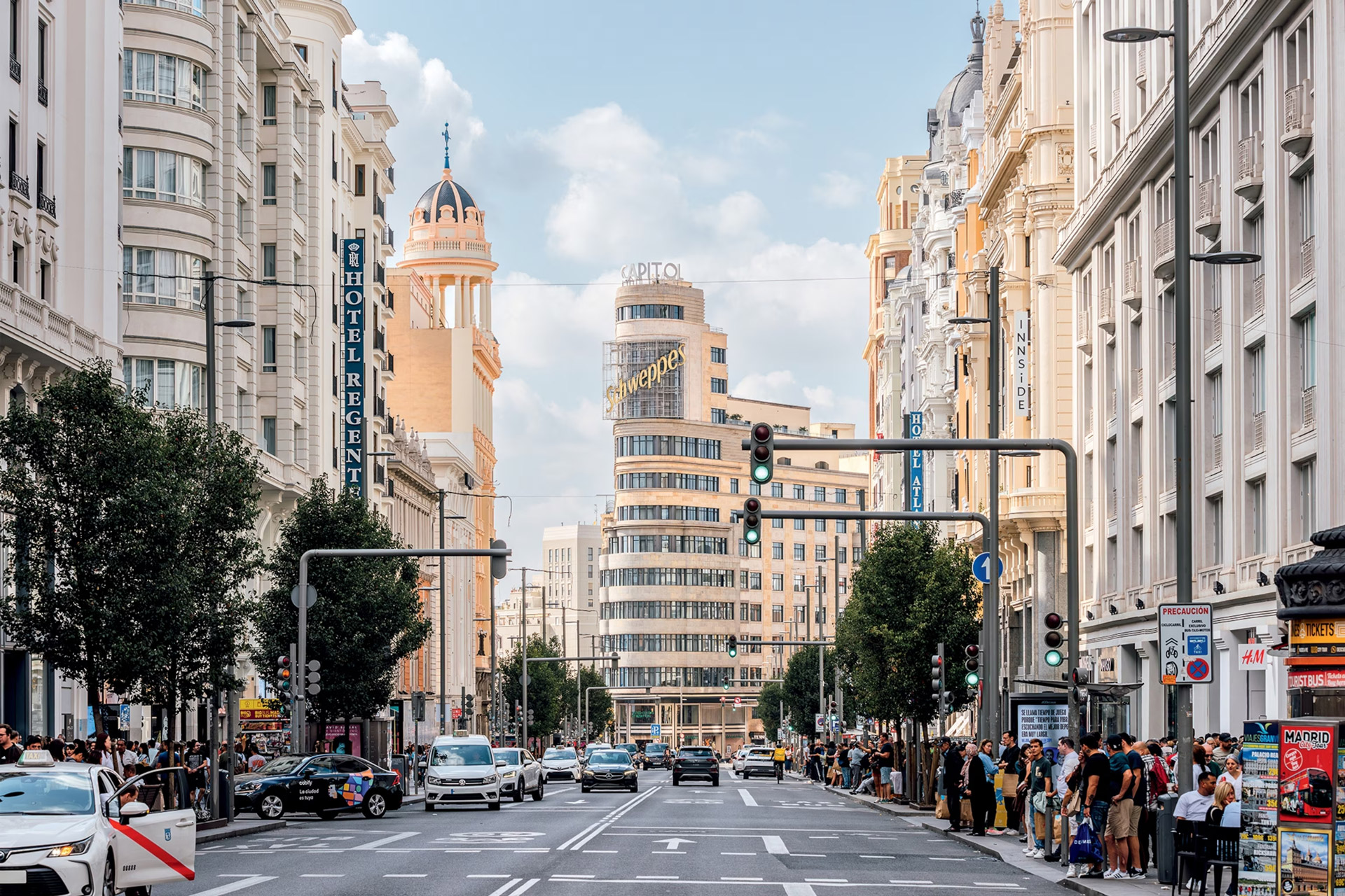 Central Madrid skyline with hotels and apartment buildings around a busy roundabout