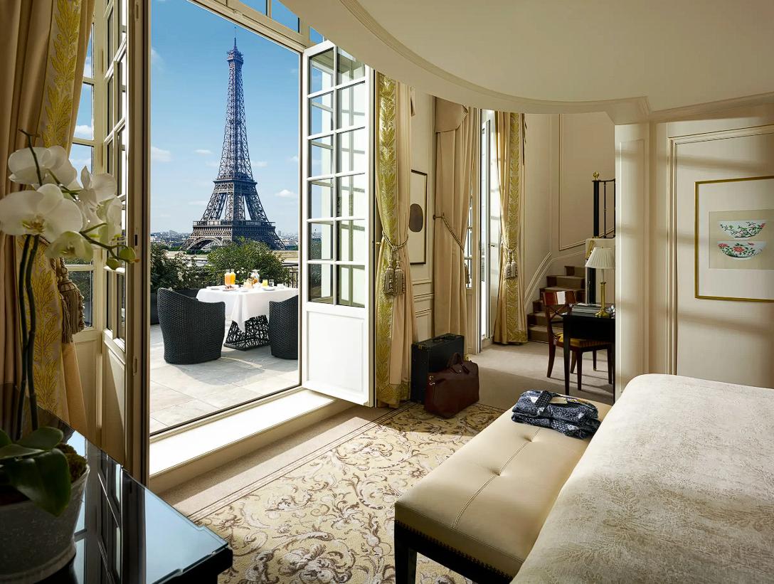 Luxury hotel room in Paris with Eiffel Tower view from a private balcony