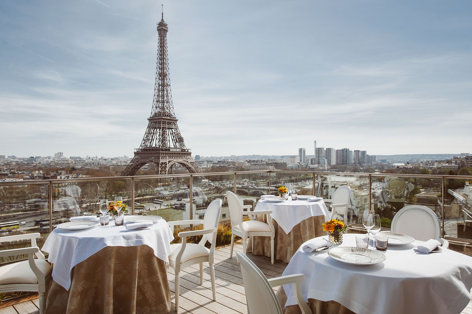 Restaurant terrace in Paris with views of the Eiffel Tower and city skyline