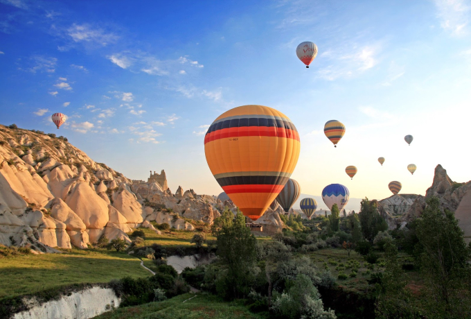 Cappadocia is famous for its surreal fairy chimneys, cave dwellings, and dramatic volcanic landscapes in central Turkey.