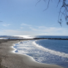 Winter sunshine over Playa de Troya beach and its breakwaters in Costa Adeje, Tenerife