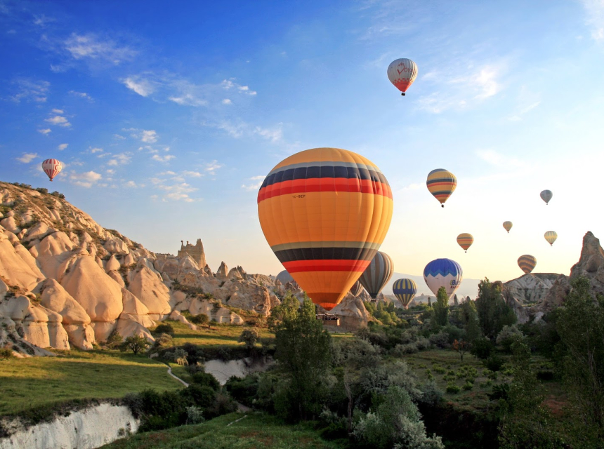 Cappadocia is famous for its surreal fairy chimneys, cave dwellings, and dramatic volcanic landscapes in central Turkey.
