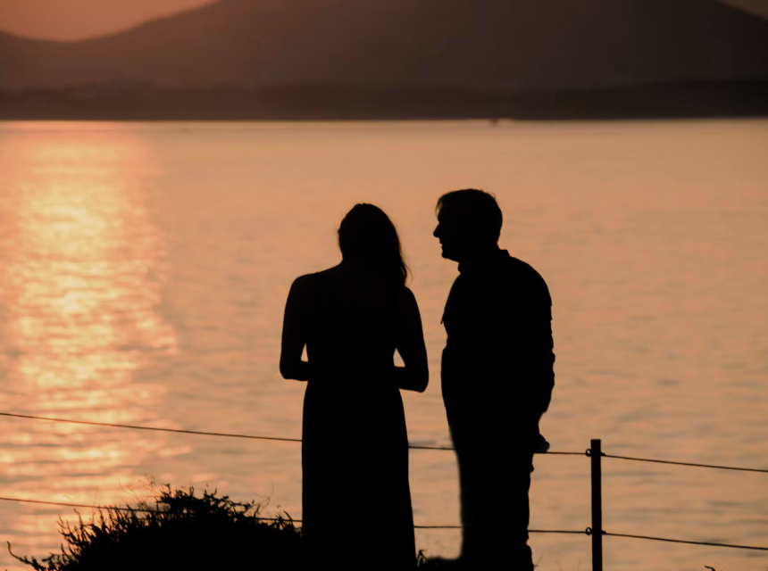 Couple watching the sunset on Naxos, one of the best Greek islands for couples