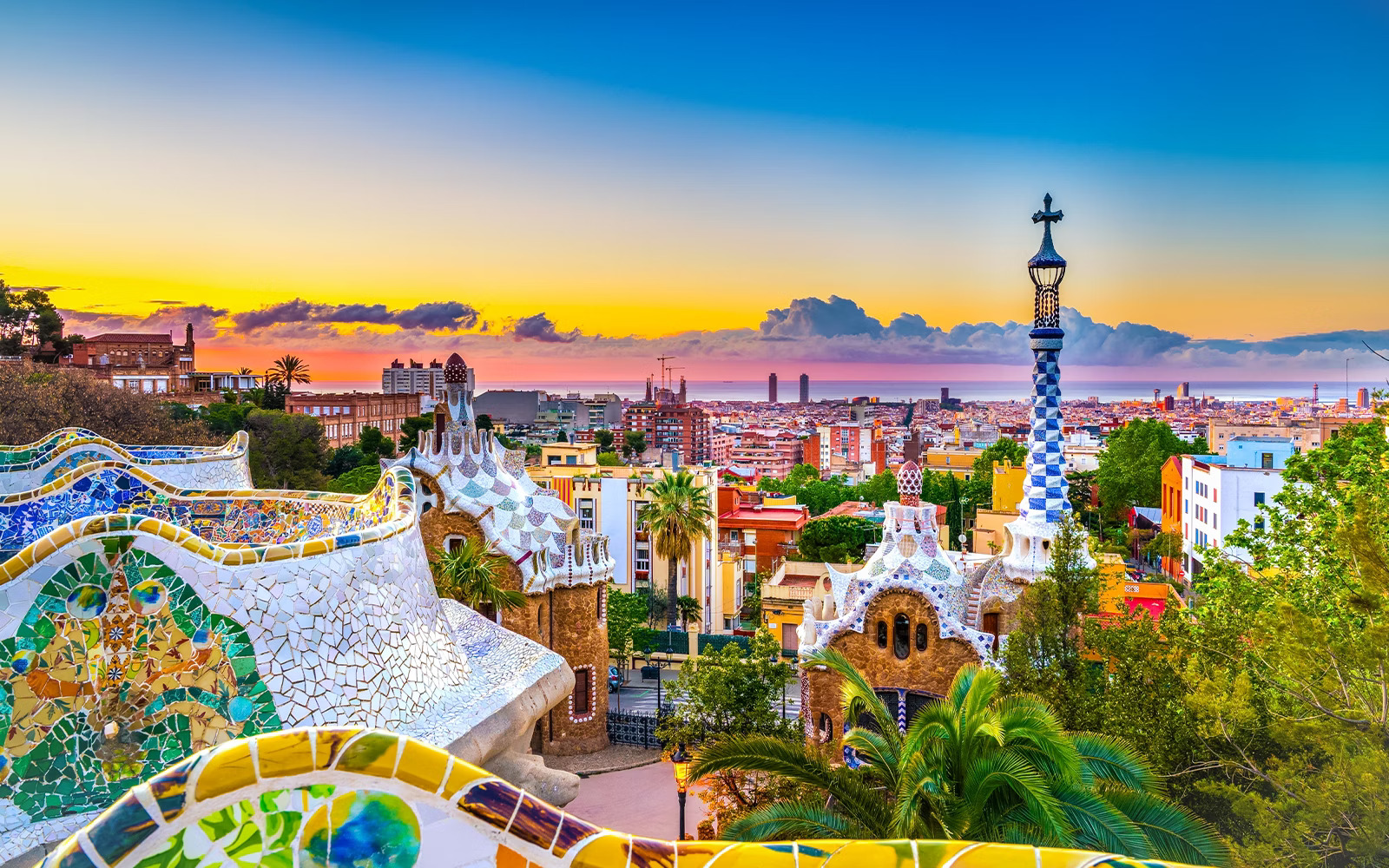 Panoramic view of Park Güell with Barcelona city skyline at sunrise