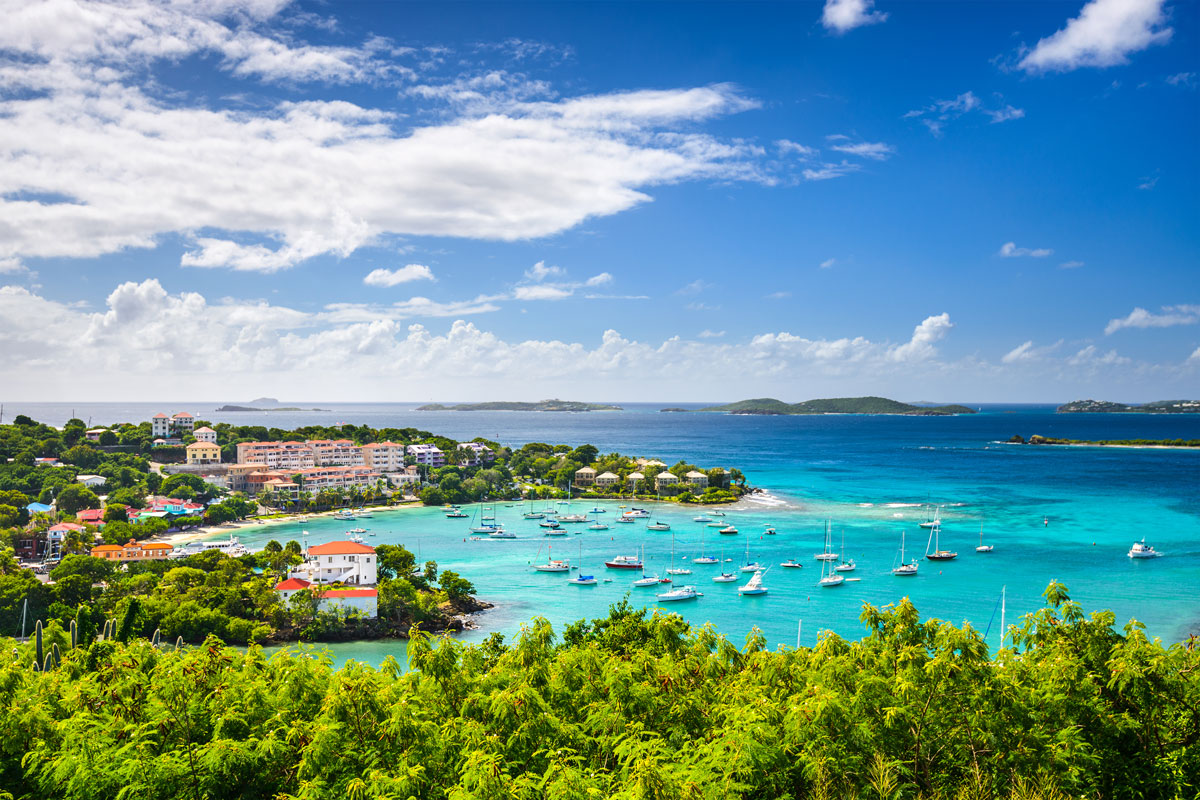 Typical weather conditions in the Virgin Islands with blue skies, light clouds, and calm coastal waters